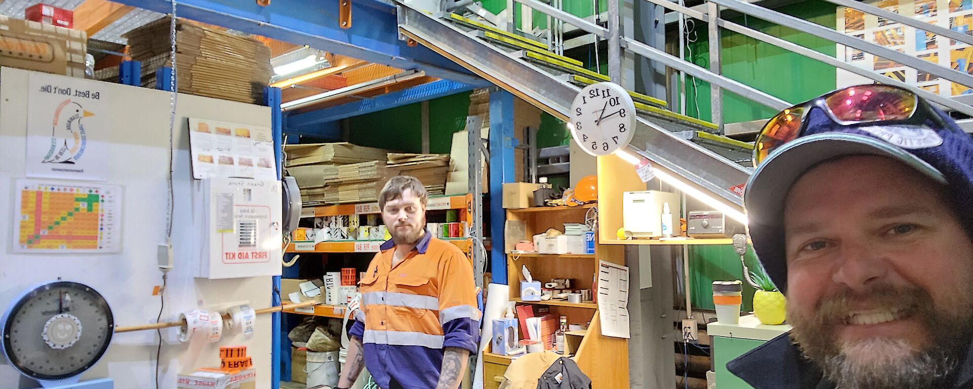 A selfie photograph taken by Stuart with Ryan in the background in the Greenstore