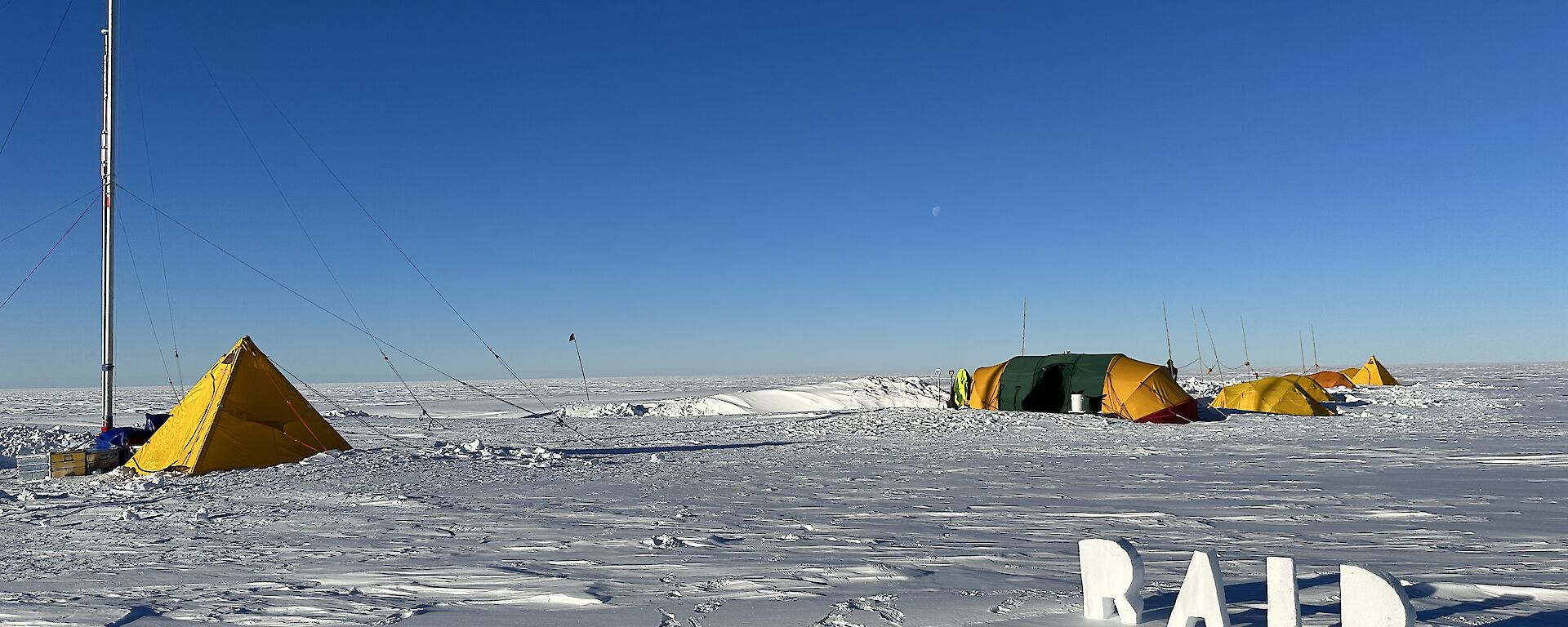Camp set up on snow with ice drill