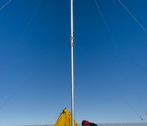 Expeditioner working with ice drill in the Antarctic