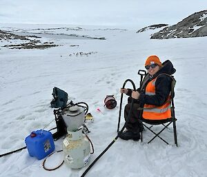 Scientist using a steam drill to help gather data