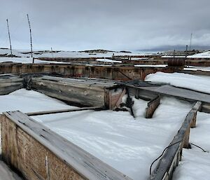Old wooden buildings buried in snow