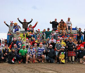 XMas photo everyone with their arms in the air