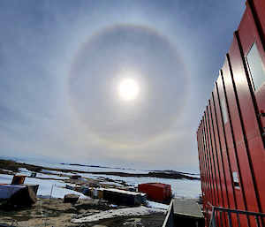 Ice ring around the sun looking north from Mawson redshed.