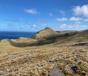Scenic view across the land to the ocean
