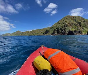 View from a small boat at sea looking towards Green Gorge