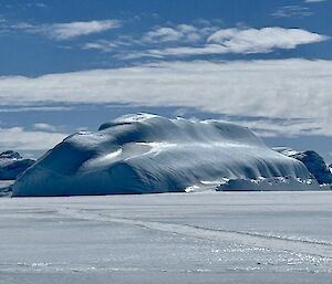 Smooth iceberg under bright sunlight