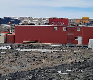 Station buildings: Foreground: Left to right Field Store and workshop with shipping containers. Background:  left to right Cranes, Heli Hut, Heli hanger, Emergency Vehicle Shelter, LADAR building, Science Building, tank 3 and 2 lids and Site Services building.