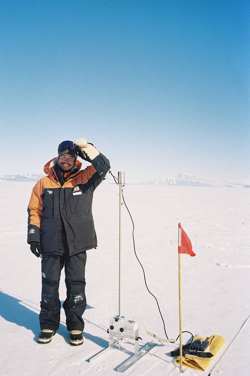 Expeditioner with equipment on the ice