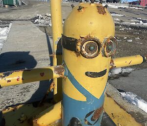 Wharf bollard painted like a Minion character