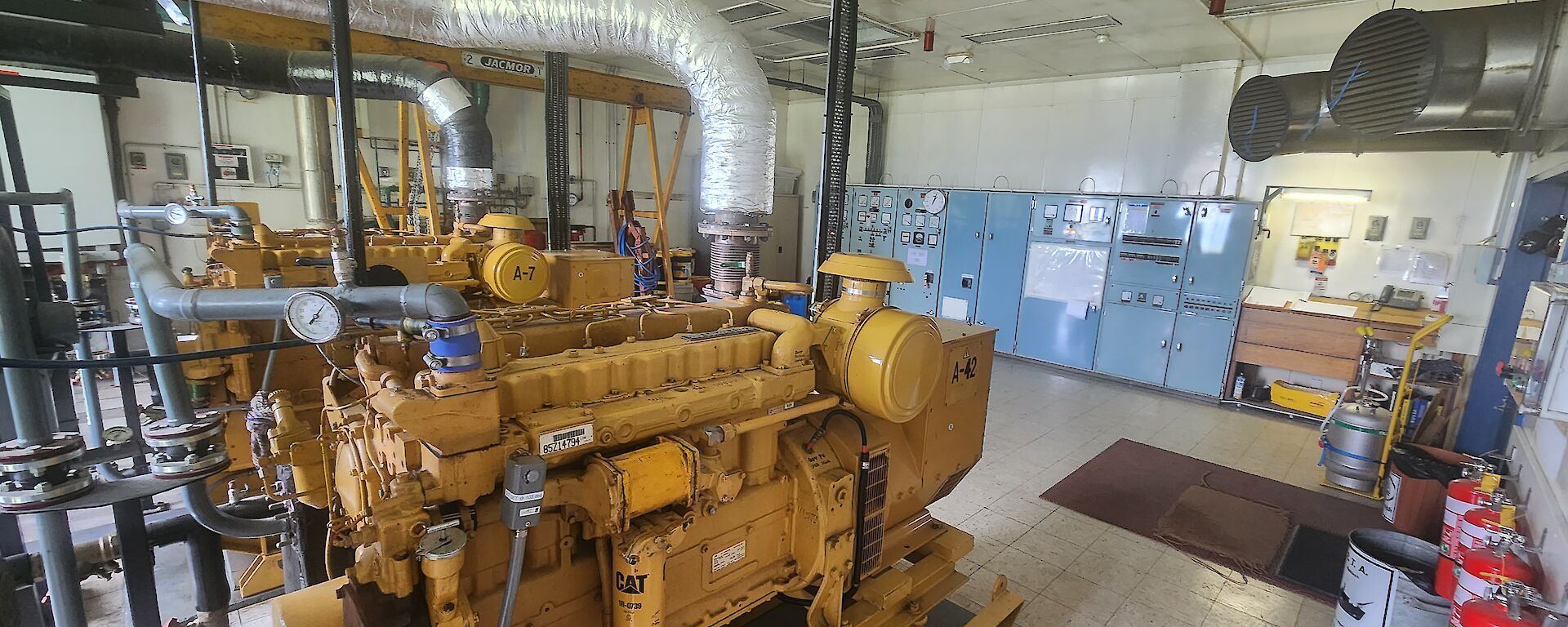 A large room with yellow generators