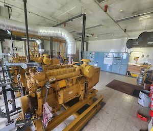 A large room with yellow generators