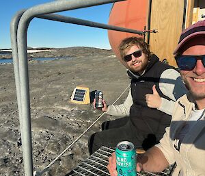 Two seabird research scientists enjoying a relaxing day in the sun.