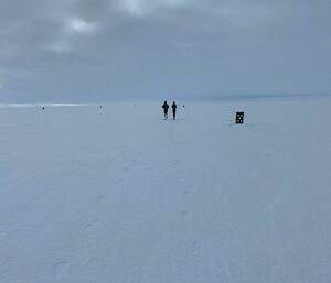 two marathon runners on sonw track