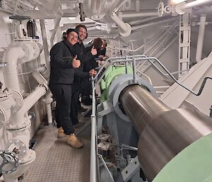 Two people in a ship's engine room