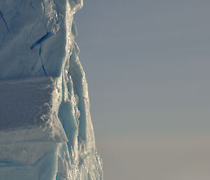 Massive iceberg rising out of the sea.