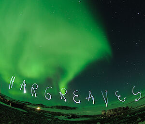 The name "Hargreaves" etched in the sky with an Aurora behind it.  Taken using 30 second timelapse.