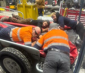 Expeditioners at Mawson flattening out the IRBs used during resupply and refuelling