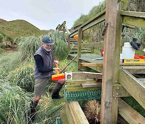 A person does work on a timber viewing platform