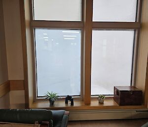 View out of the same window but looking at a whiteout.