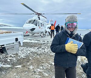 Bridget Muldoon, station supply officer with the completed paperwork necessary to deliver cargo to the ship