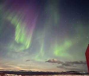 An auroral display coloured green to purple captured as it moves across the sky at Mawson recently