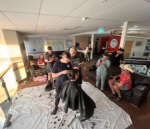 A view of many expeditioners during the hair cutting exercise