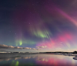 A night sky full of colourful patches of auroral light above Mawson last week