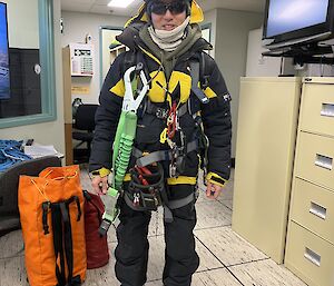 Andy wearing rigger harness at work at Mawson station