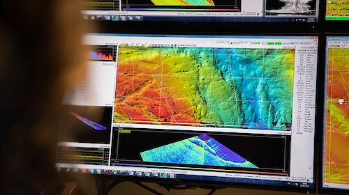 A computer screen showing a map with coloured areas depicting the different depths of the seafloor off Mawson Research station.
