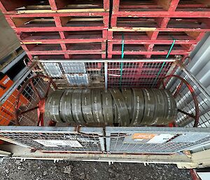 The fuel hose section back where it should be wound onto a reel and stowed in a cage pallet ready for next year's refuelling from RSV Nuyina