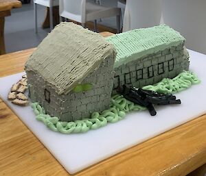 A cake in the shape of a house