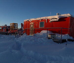 A red hut in the snow