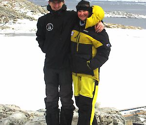 Two Antarctic expeditioners outside at Casey research station.