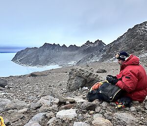 Richard Heaton looks out over the Framnes Mountains to the south of Mawson stationstopped for a snack on a walk in the mountains