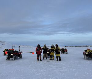 Expeditioners doing sea ice drilling