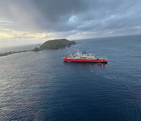 A ship in a bay near an island
