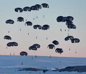 Parachutes and loads nearly on the sea-ice in front of Mawson station