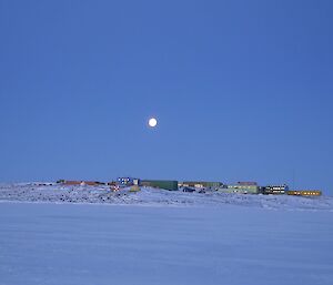 Davis Station with the moon above.