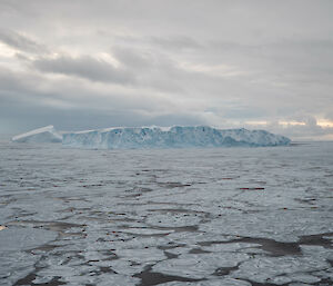 An iceberg on a cloudy day.