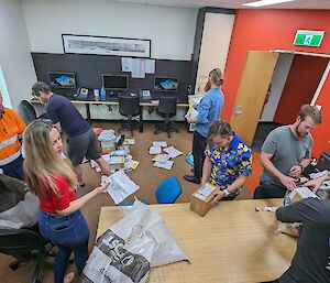 Casey expeditioners sorting a fresh mail bag