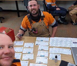 Postmaster owen horton and junior probationary post work dave wardle cancelling outgoing mail