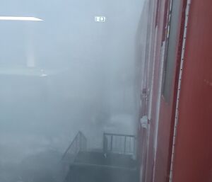 Looking out into a blizzard from the Red shed at Mawson
