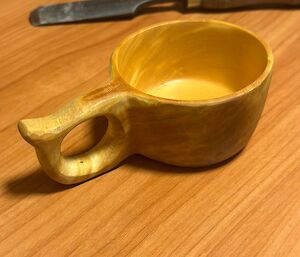 A carved, wooden cup