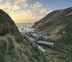 Looking down on station buildings from up grassy slope