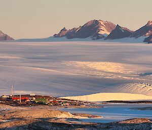 A view of Mawson station, the ice plateau and the Framnes Mts behind from Welch Island