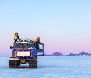 Braiden Richards (on the right), Bridget Muldoon and Bryce Kennedy in a blue Hagglunds near Mawson station recently