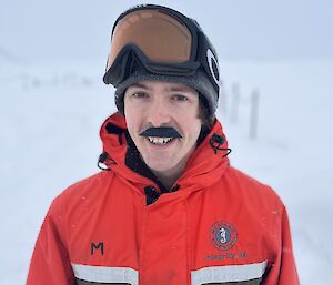 team member Thomas sporting a very sharp cut-out moustache