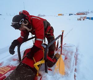 expeditioner pulling the 'patient' into the rescue alive pontoon on snow covered sea ice