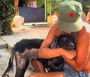mitch holding the rescue dog