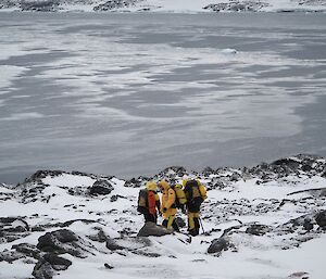 three expeditions traveling down to water edge
